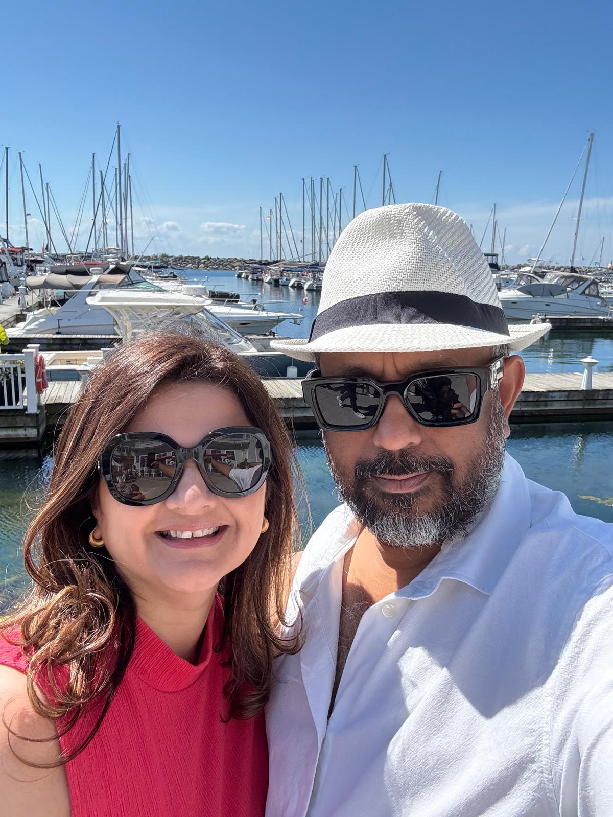 Chandni and Ron at the marina — founders of Chalet Paradise